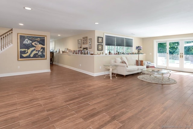 living room featuring wood-type flooring and french doors