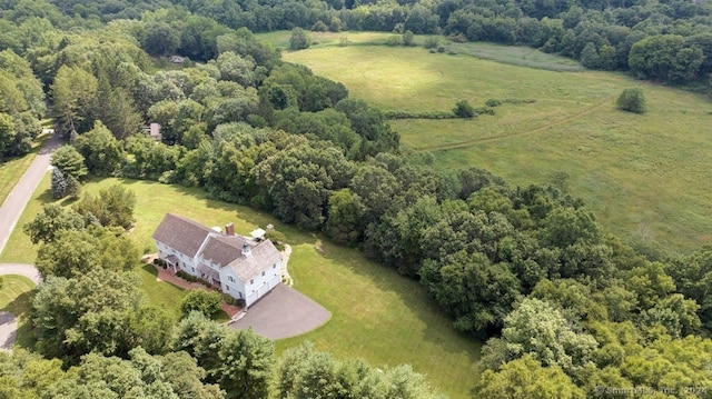 birds eye view of property with a rural view