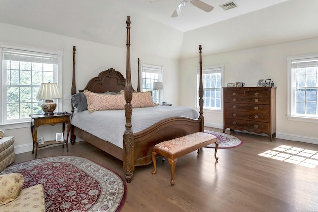 bedroom featuring hardwood / wood-style flooring, ceiling fan, and lofted ceiling