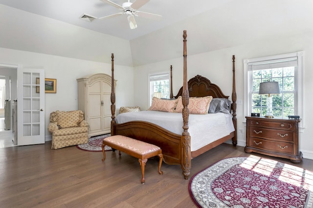 bedroom featuring dark wood-type flooring, ceiling fan, and vaulted ceiling