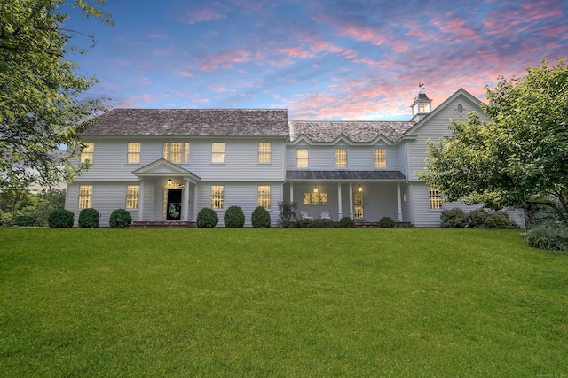 view of front of house with a lawn