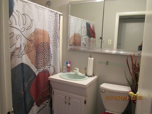 bathroom featuring vanity and toilet