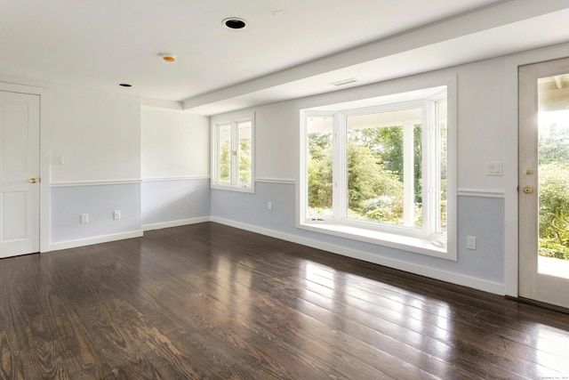 unfurnished room with dark hardwood / wood-style floors