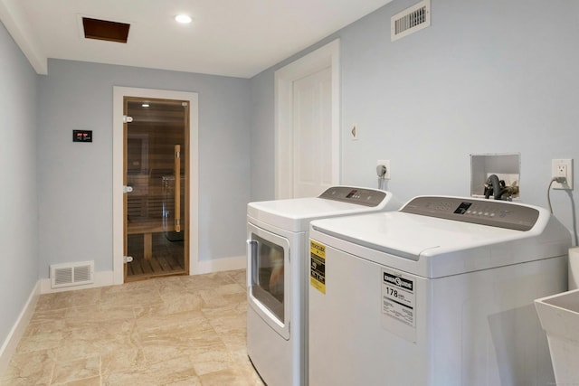 laundry room with washer and dryer