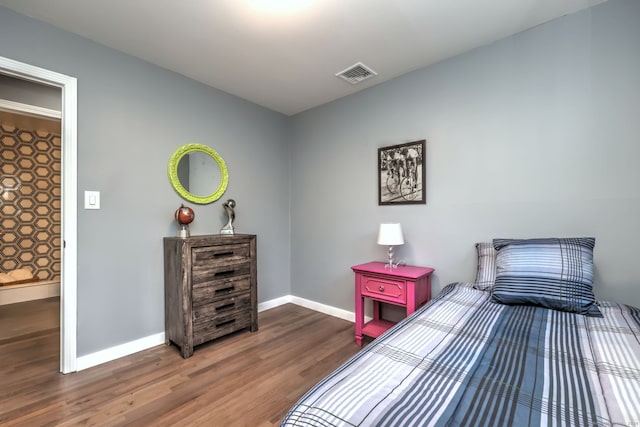 bedroom featuring dark hardwood / wood-style flooring