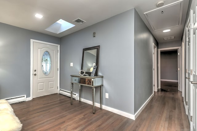 foyer with a baseboard heating unit and dark hardwood / wood-style flooring