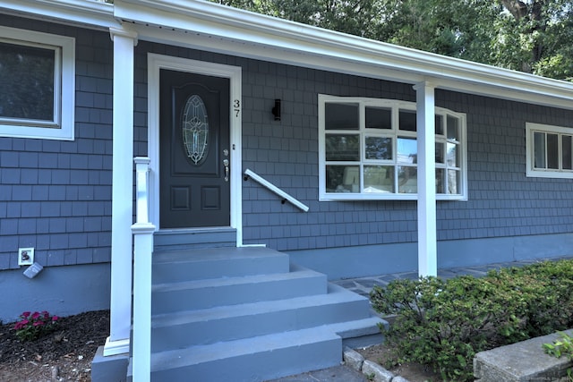 doorway to property featuring covered porch