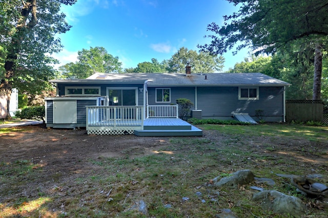 back of house featuring a deck and central AC unit