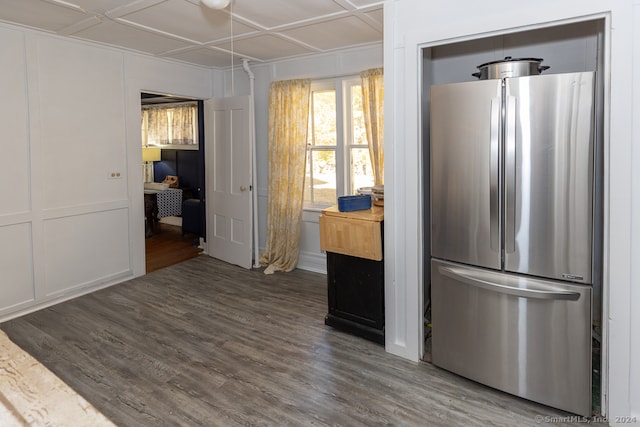 kitchen featuring stainless steel refrigerator and dark hardwood / wood-style floors