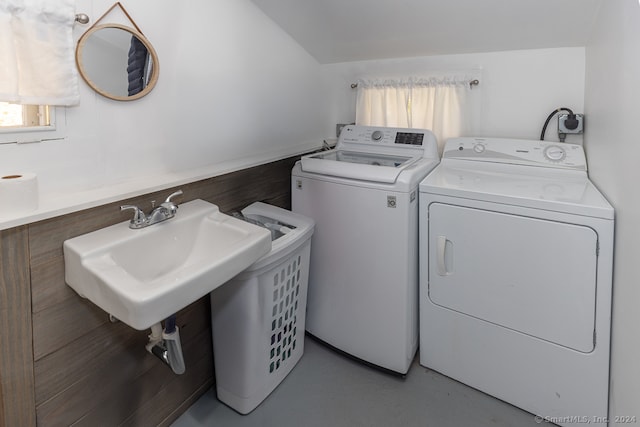 clothes washing area with sink and washing machine and dryer