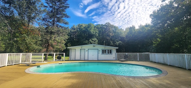 outdoor pool featuring a deck and an outdoor structure