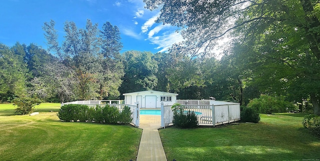 pool with an outbuilding and a lawn