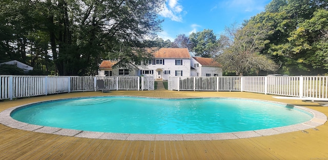 view of swimming pool with a fenced in pool