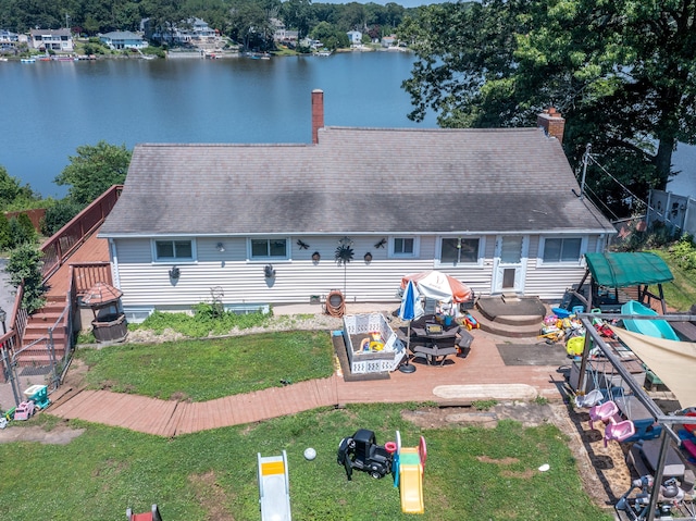 rear view of property featuring a water view