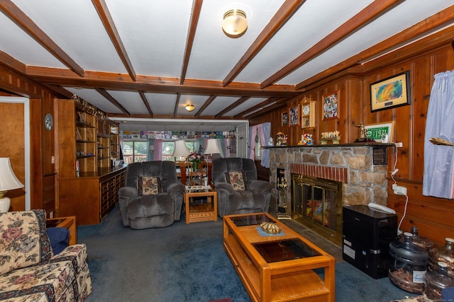 living room with beamed ceiling, wood walls, and dark colored carpet