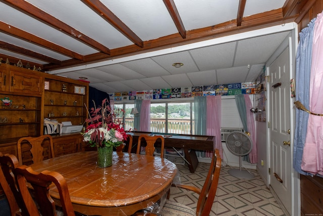 dining area with a paneled ceiling