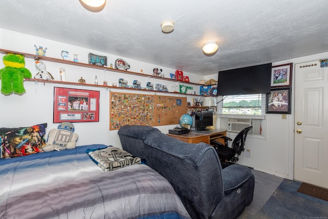 bedroom with cooling unit and a textured ceiling