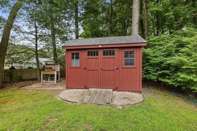 view of outdoor structure with a lawn