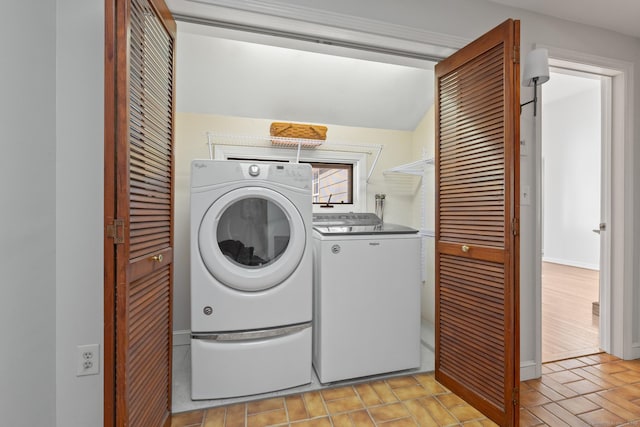 laundry room featuring washing machine and dryer