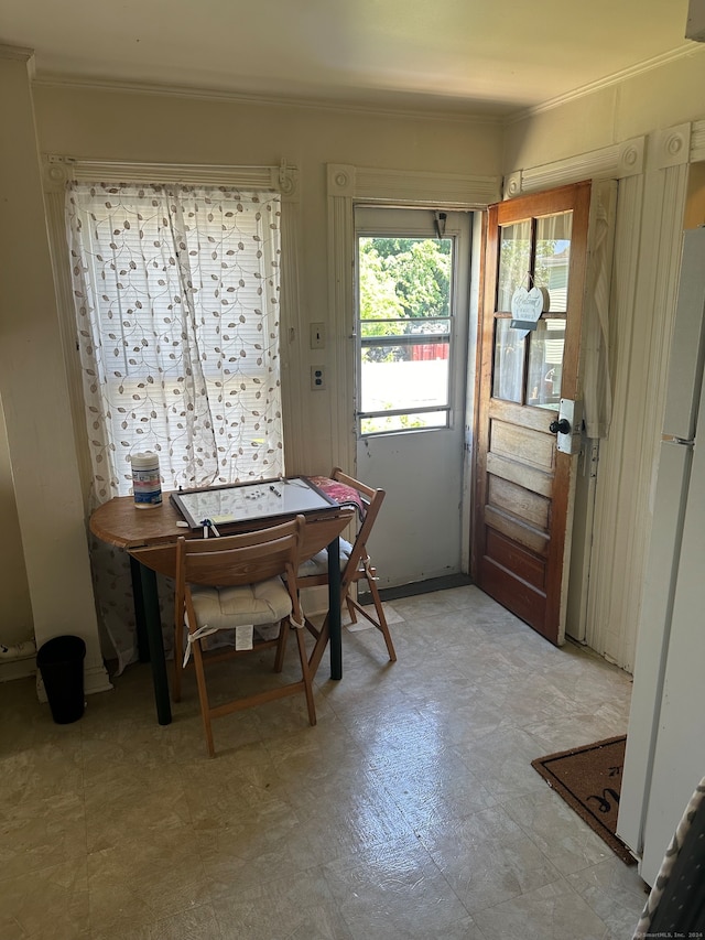 doorway to outside with tile patterned floors