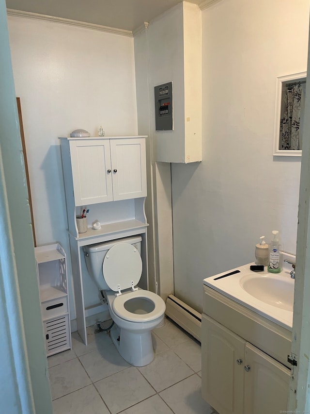 bathroom with tile patterned floors, vanity, toilet, and baseboard heating