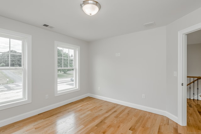 unfurnished room featuring light hardwood / wood-style flooring