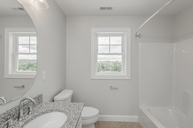 full bathroom with plenty of natural light, vanity, shower / bath combination, and toilet