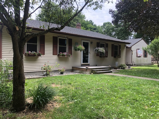 ranch-style house with a front yard