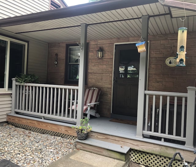 property entrance with covered porch