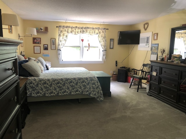 carpeted bedroom featuring a textured ceiling