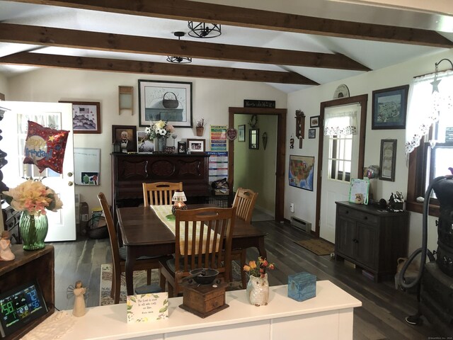 dining space featuring lofted ceiling with beams, dark wood-type flooring, and a baseboard radiator