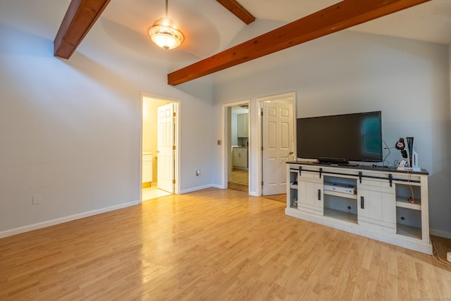 unfurnished living room featuring ceiling fan, lofted ceiling, and light hardwood / wood-style flooring