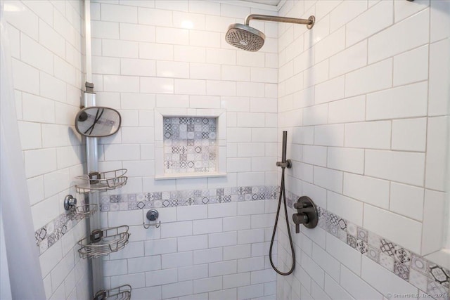 bathroom with tiled shower