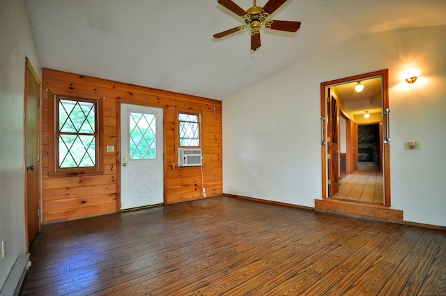 entryway with lofted ceiling, wood walls, ceiling fan, hardwood / wood-style floors, and cooling unit