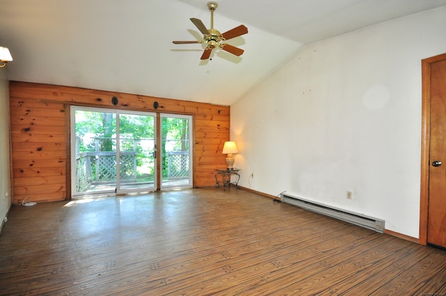 spare room with hardwood / wood-style flooring, ceiling fan, vaulted ceiling, wood walls, and a baseboard radiator