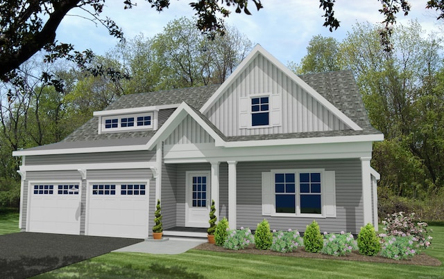 view of front of property with a porch, a garage, and a front lawn