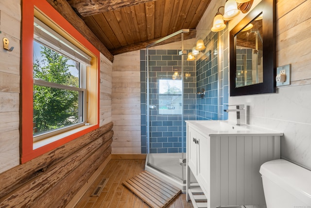 bathroom with hardwood / wood-style flooring, a healthy amount of sunlight, wood walls, and wooden ceiling