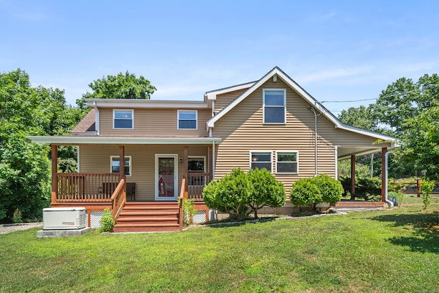 back of house featuring covered porch and a yard