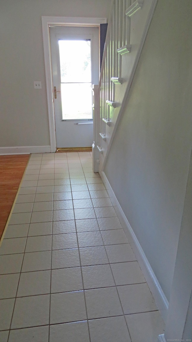 entryway featuring light tile patterned flooring