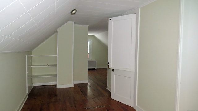 bonus room featuring dark hardwood / wood-style floors and lofted ceiling