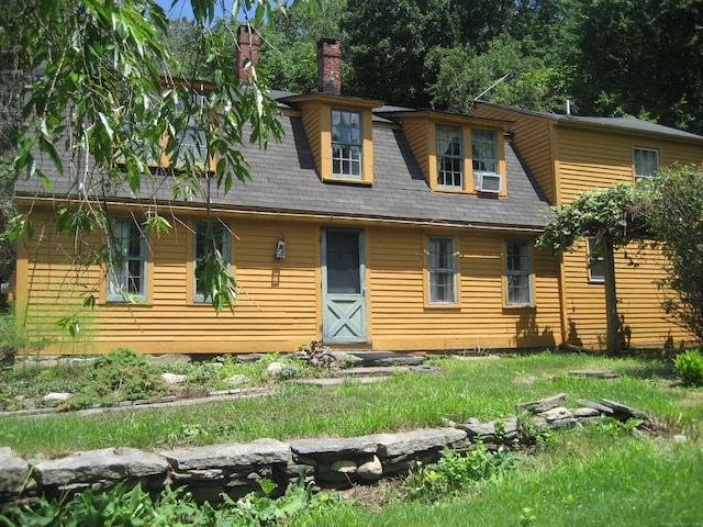 view of front facade with cooling unit