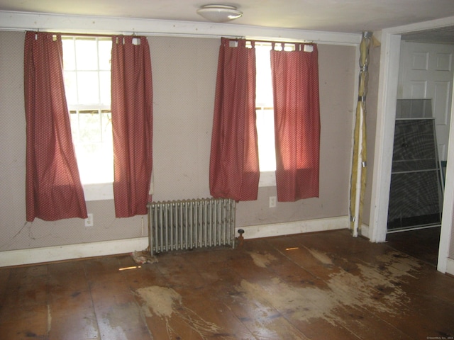 spare room featuring radiator