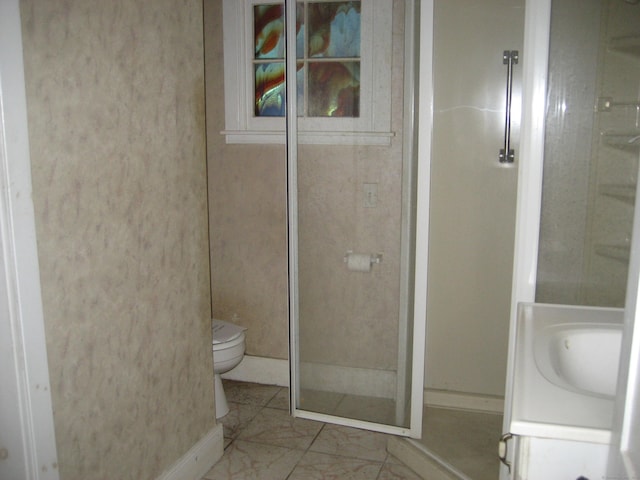 bathroom featuring vanity, toilet, and walk in shower