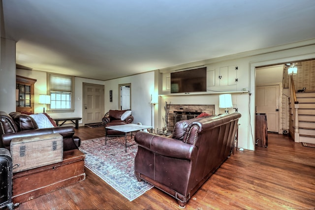 living room featuring a fireplace and wood-type flooring