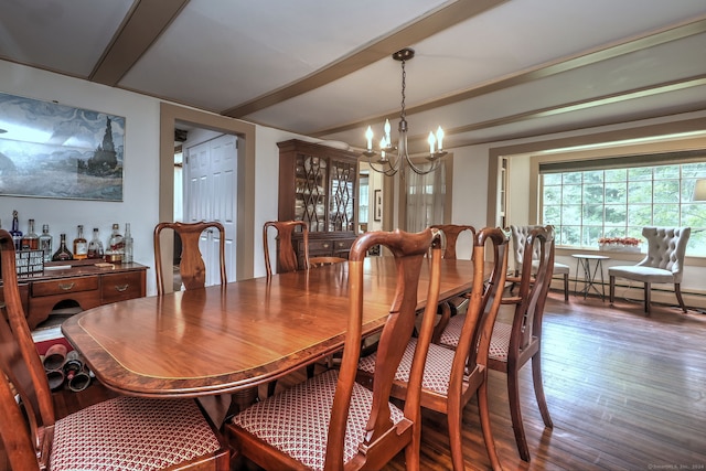 dining room with an inviting chandelier, a baseboard radiator, and wood-type flooring