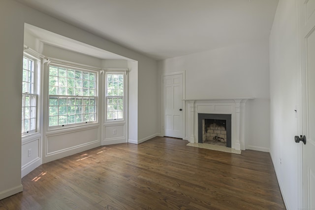 unfurnished living room featuring dark hardwood / wood-style flooring