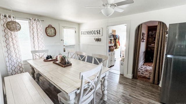 dining area with dark hardwood / wood-style floors and ceiling fan