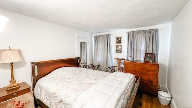 bedroom with wood-type flooring