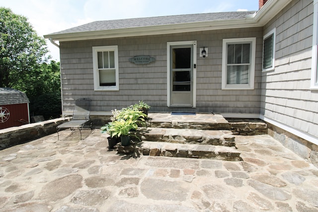 property entrance with a patio area