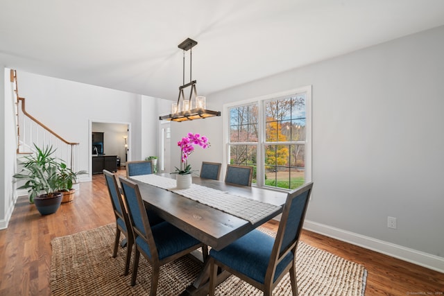 dining room featuring a notable chandelier and wood-type flooring